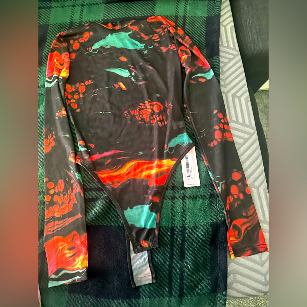 Im selling 3 tops one is a Bodysuit. Never worn brand nee with tags